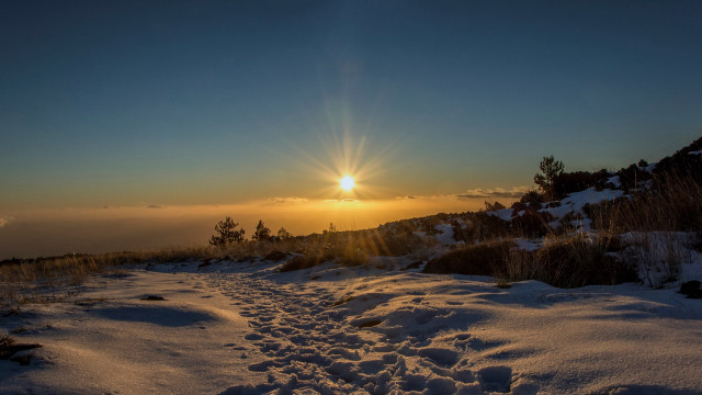 Snowy trail sunset city mountains free wallpaper - medium preview image