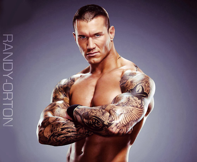 Tattooed man arms crossed posing free wallpaper - medium preview image