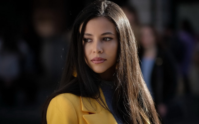 Woman yellow coat street corner free wallpaper - medium preview image