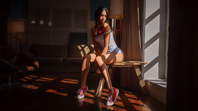 Woman sitting room sunlight tilt free wallpaper - medium preview image
