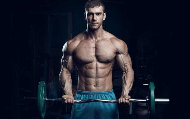 Muscular man barbell dark room free wallpaper - medium preview image