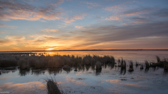 Sunset water grass cityscape clouds free wallpaper - medium preview image