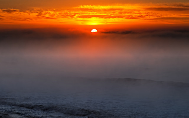 Sunset foggy ocean boat matte free wallpaper - medium preview image