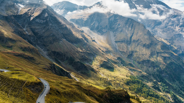 Winding mountain road cloudy sky free wallpaper - medium preview image