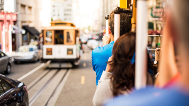 Woman streetcorner trolley car bokeh free wallpaper - medium preview image