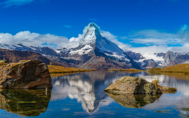 Mountain reflection rock beach sky free wallpaper - medium preview image