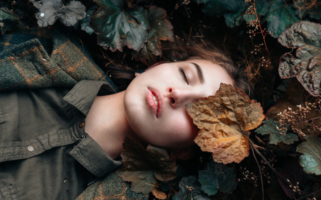 Woman leaves lying closed eyes free wallpaper for desktop - medium preview image