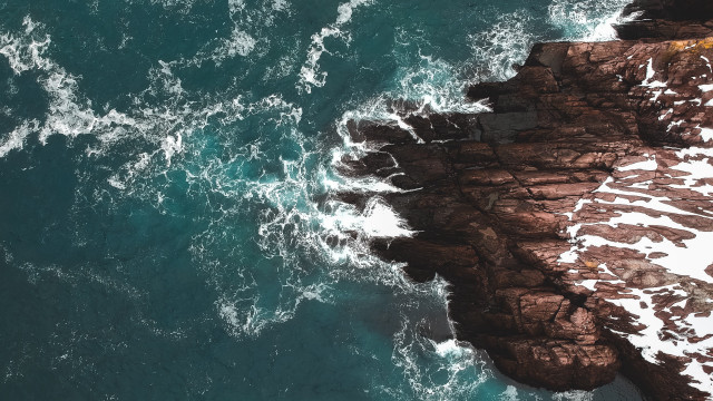Rocky coastline ocean birdseye night free wallpaper - medium preview image