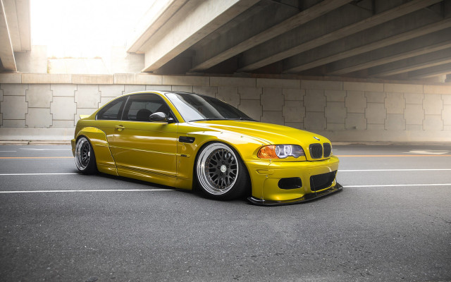 Yellow car parked bridge building free wallpaper - medium preview image