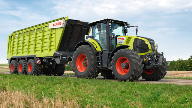 Tractor field sunny blue sky free wallpaper - medium preview image
