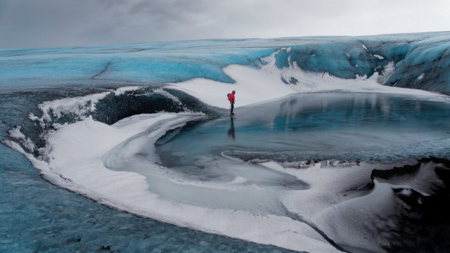Glacier man red jacket umbrella free wallpaper - medium preview image