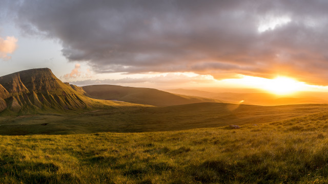 Grassy field mountain sunset sheep free wallpaper - medium preview image