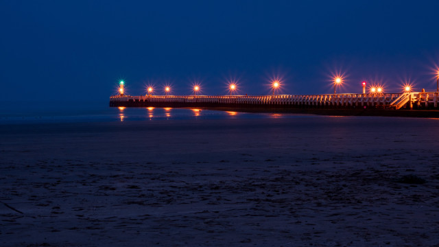 Pier lights night beach person free wallpaper - medium preview image
