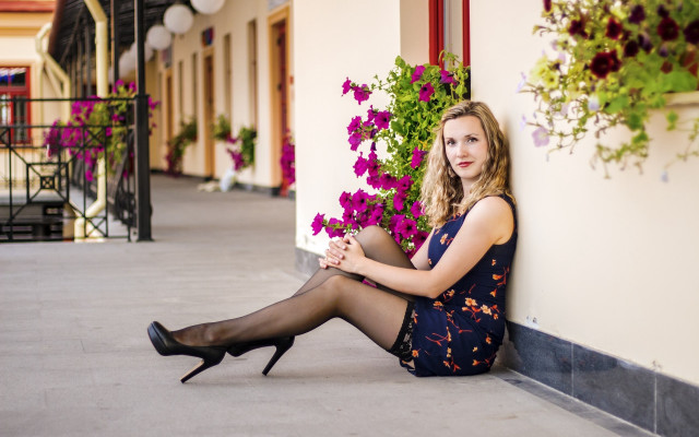 Woman sitting building flowers portrait free wallpaper - medium preview image