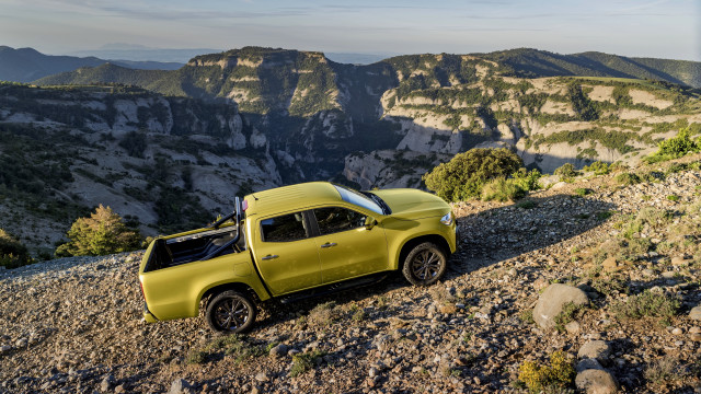 Yellow truck rocky hill mountains free wallpaper - medium preview image