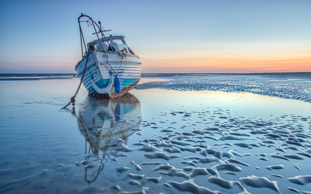 Boat beach sunset footprints ocean free wallpaper - medium preview image