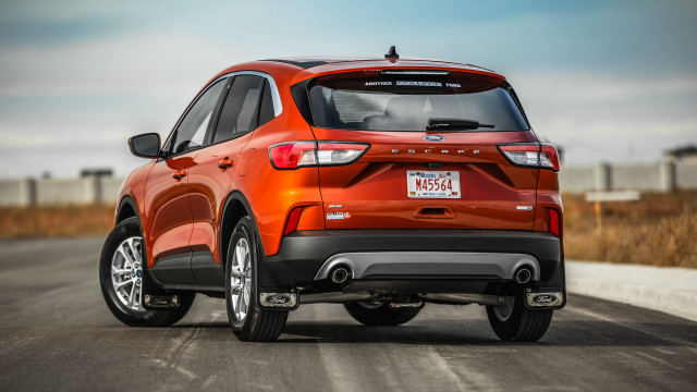 Red ford suv driving daytime free wallpaper - medium preview image