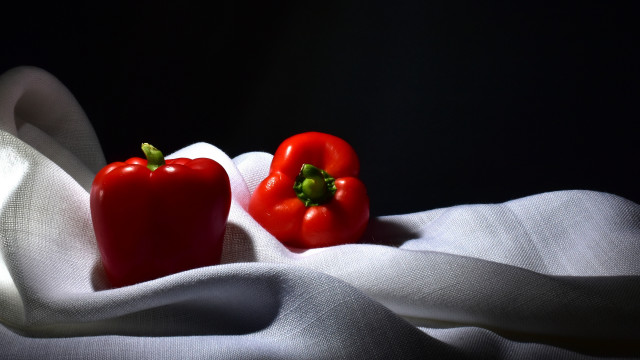Red peppers white tablecloth black free wallpaper - medium preview image