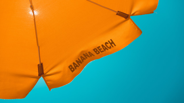 Orange umbrella banana beach blue free wallpaper - medium preview image