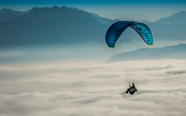 Parasailing clouds mountains beach sunset free wallpaper - medium preview image