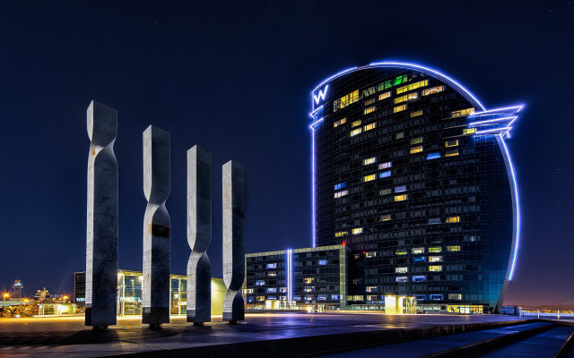 Tall building giant clock night free wallpaper - medium preview image