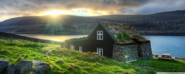 Grass roof house lake mountains free wallpaper - medium preview image
