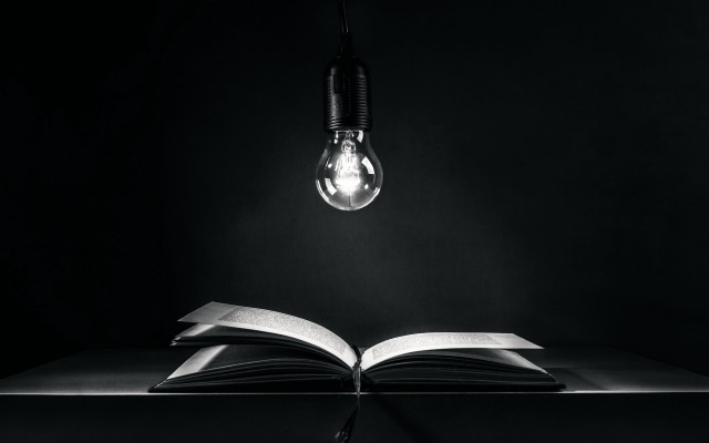 Book lightbulb table black background free wallpaper - medium preview image