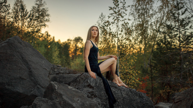 Woman sitting rock black dress free wallpaper - medium preview image