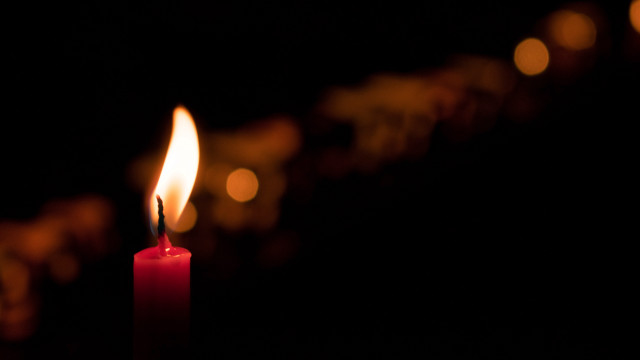Candle red flame dark blurry free wallpaper - medium preview image
