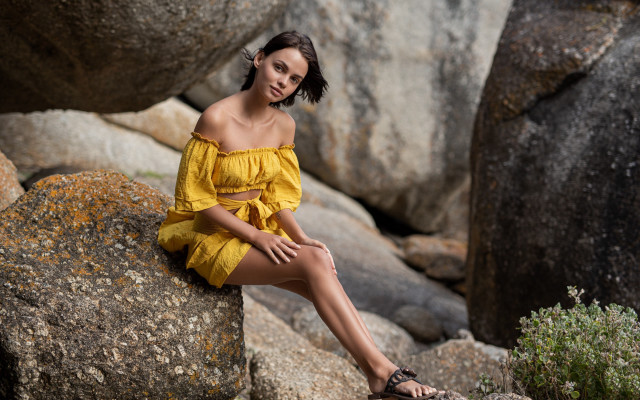 Woman yellow dress sitting outdoors free wallpaper - medium preview image