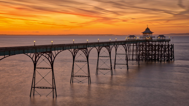 Pier lights sunset ocean lighthouse free wallpaper - medium preview image