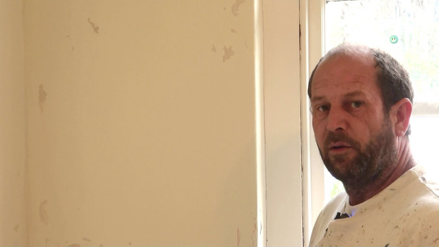 Man standing window white shirt free wallpaper - medium preview image