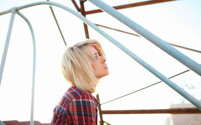Blonde woman metal structure sky free wallpaper - medium preview image