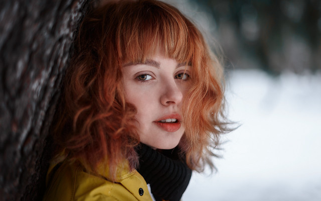 Redhead woman leaning tree snow free wallpaper - medium preview image