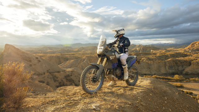 Dirtbike hill mountains clouds panfuturism free wallpaper - medium preview image