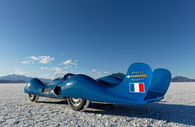 Blue racecar beach mountains clouds free wallpaper - medium preview image