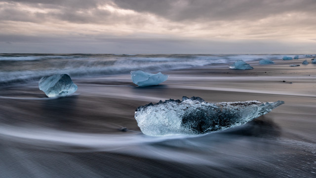 Icebergs beach ocean cloudy sky free wallpaper - medium preview image