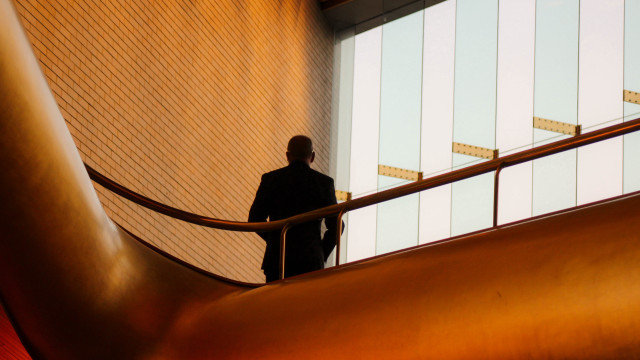 Man in suit staircase building free wallpaper - medium preview image