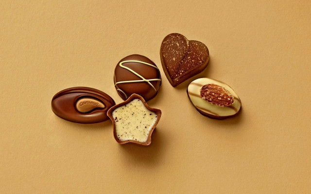 Chocolates toppings table yellow background free wallpaper - medium preview image