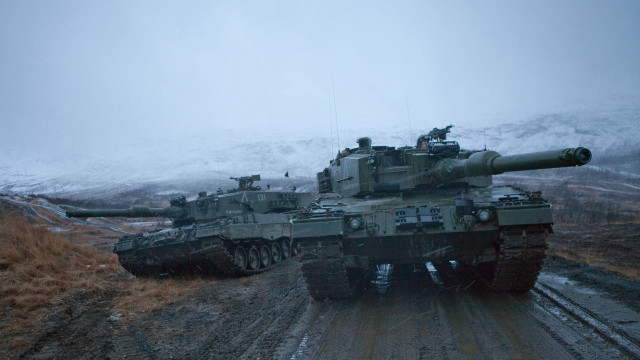 Tanks snow road grass bushes free wallpaper - medium preview image