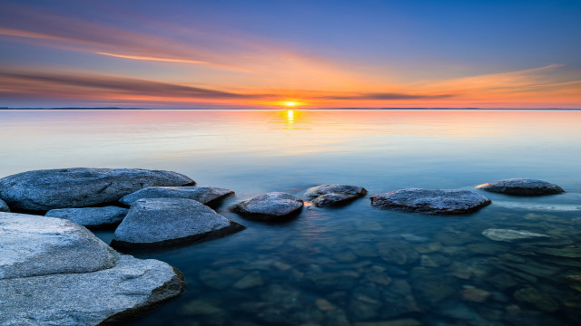 Sunset water rocks beach scene free wallpaper - medium preview image