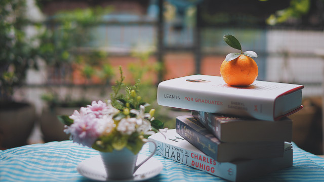 Stack books orange vase flowers #2 free wallpaper - medium preview image