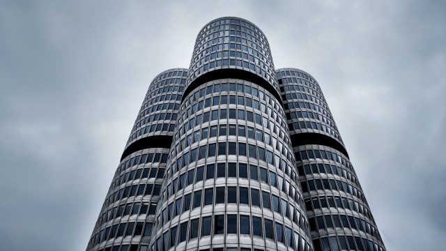 Tall building sky clouds clock free wallpaper - medium preview image
