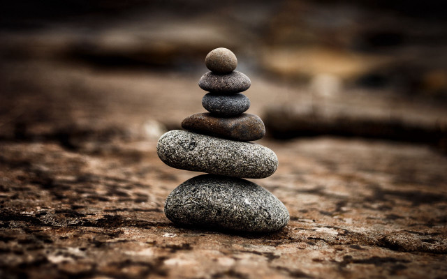 Stacked rocks forest sunset blurry free wallpaper - medium preview image