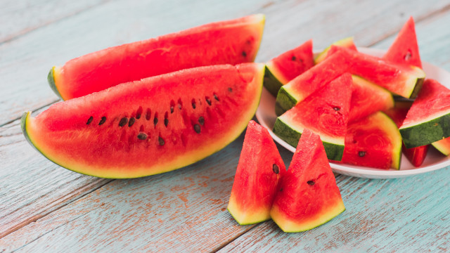 Watermelon slices wooden table bowl free wallpaper - medium preview image