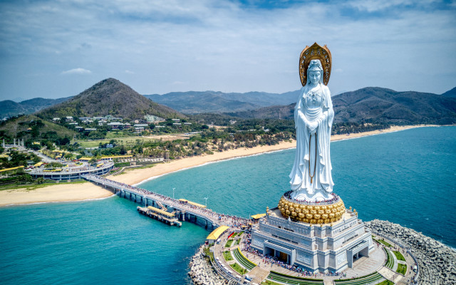 Large statue island bridge ocean free wallpaper - medium preview image