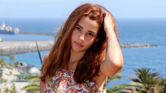 Red haired woman ocean pier free wallpaper - medium preview image