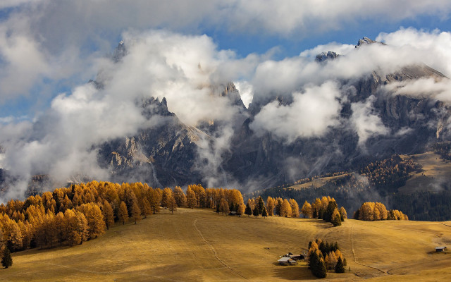Mountain range trees houses clouds free wallpaper - medium preview image