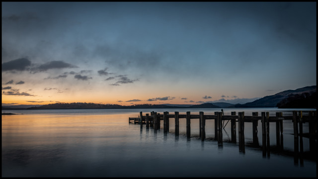 Docked lake mountains sunset cloudy free wallpaper - medium preview image