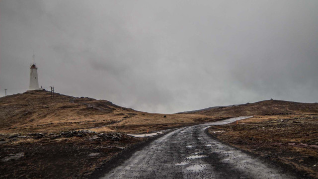 Dirt road lighthouse cloudy gray free wallpaper - medium preview image